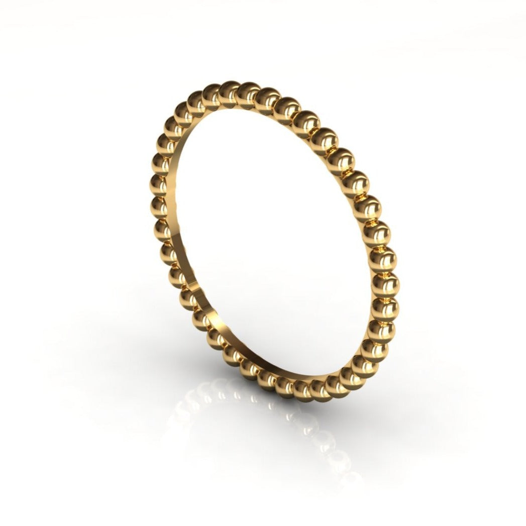 Parlé gold bead ring worn on hand, lifestyle shot