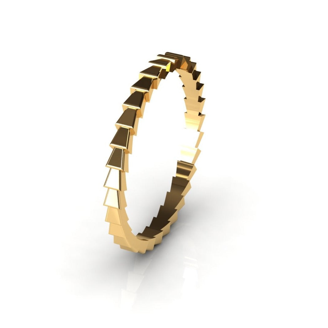 Gold ring with snake-skin texture, close-up
