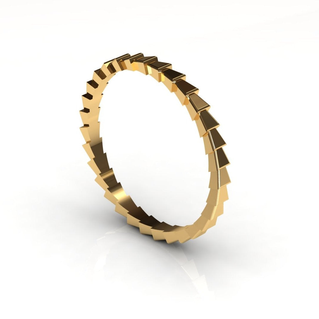 Gold snake-skin textured ring worn on hand, close-up