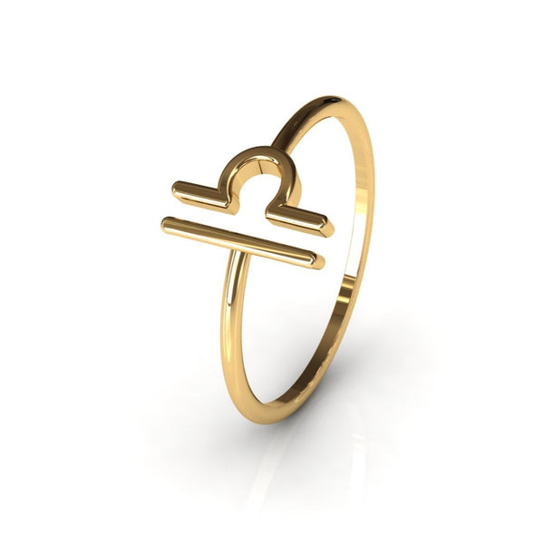 14k gold Libra ring detail shot, white grey background
