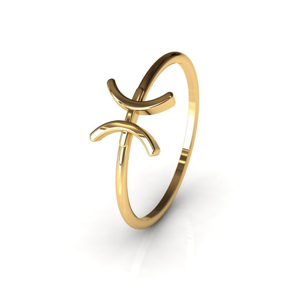Pisces zodiac gold ring on warm white studio background, front view
