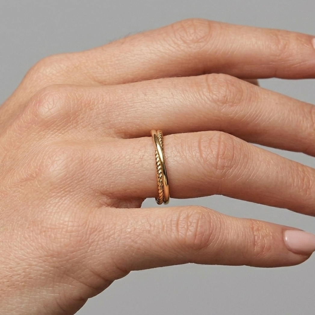 14K gold entwined ring styled on hand, natural light side view and close up 