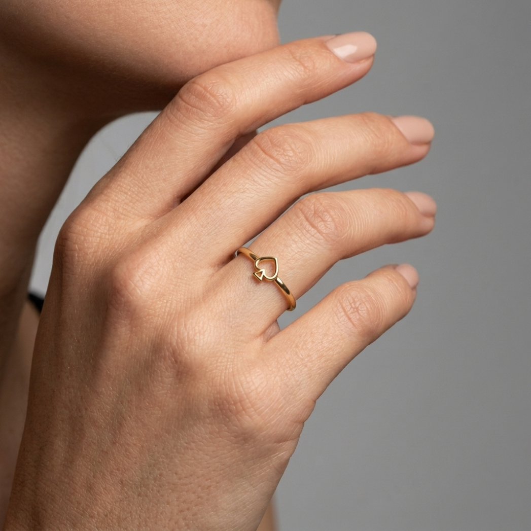 Queen of Spades solid gold ring, close-up front view , model photo lifestyle
